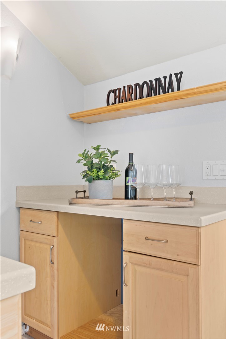 554 Bronson Way Northeast Renton, WA 98056 - Photo 14 of 35 a kitchen with a sink and a refrigerator