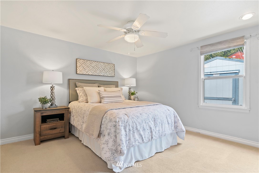 554 Bronson Way Northeast Renton, WA 98056 - Photo 18 of 35 a bedroom with a bed and a window