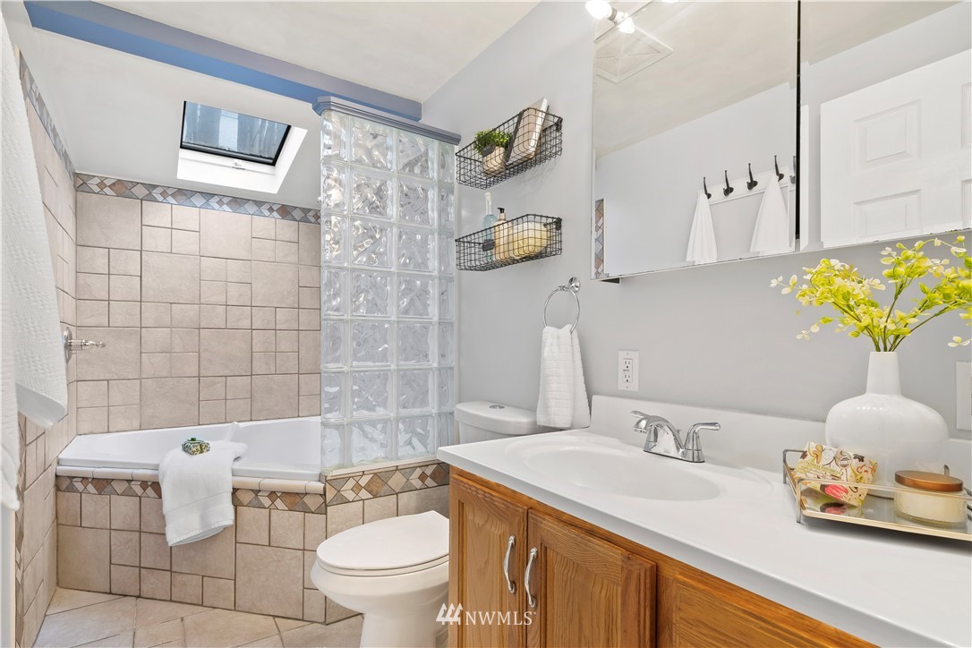 554 Bronson Way Northeast Renton, WA 98056 - Photo 19 of 35 a bathroom with a sink toilet and shower
