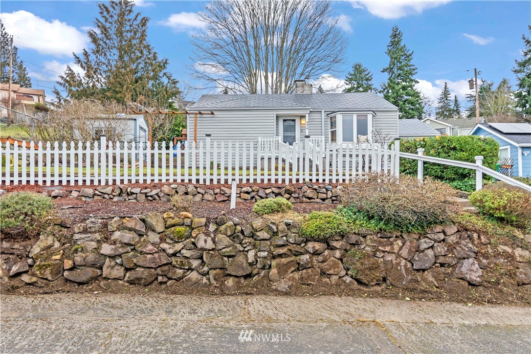 554 Bronson Way Northeast Renton, WA 98056 - Photo 2 of 35 a view of a house with a wooden fence