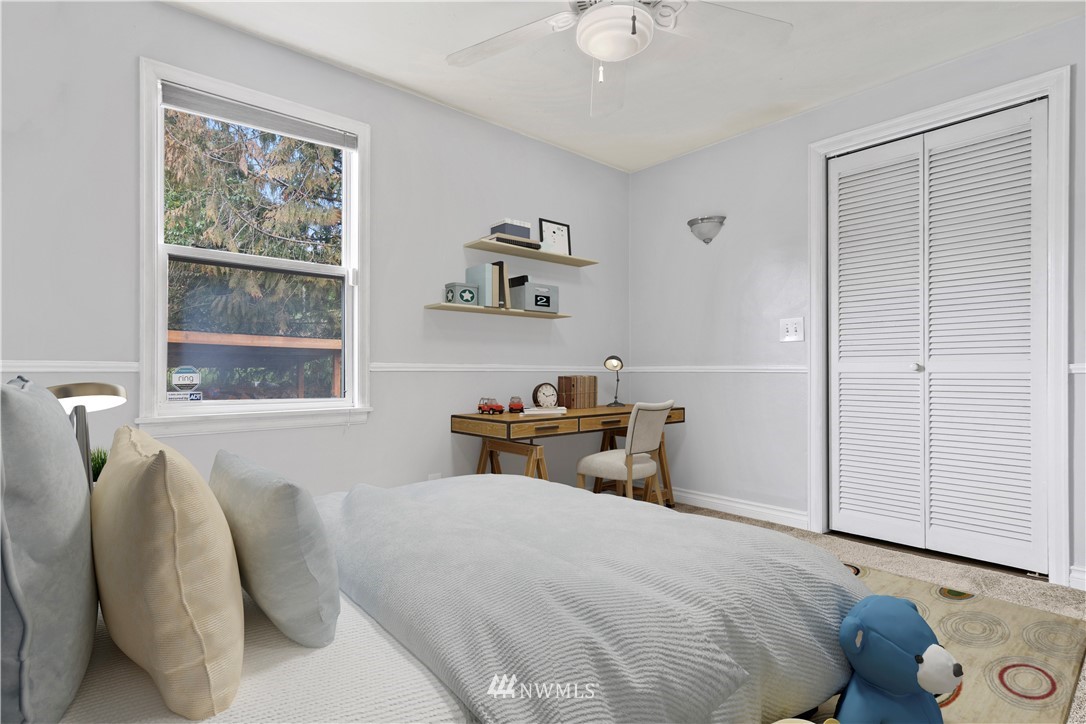 554 Bronson Way Northeast Renton, WA 98056 - Photo 21 of 35 a bedroom with a bed and a window