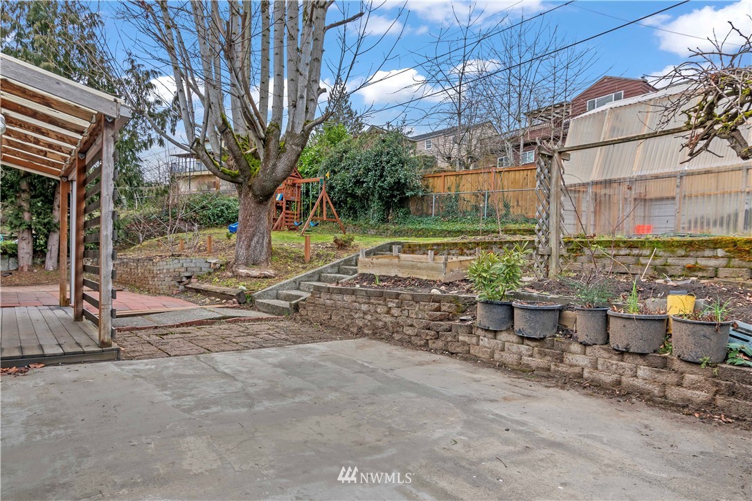 554 Bronson Way Northeast Renton, WA 98056 - Photo 24 of 35 a view of a backyard with wooden fence