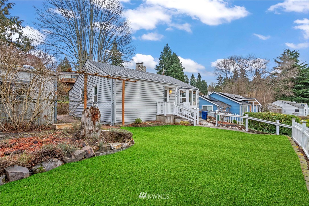 554 Bronson Way Northeast Renton, WA 98056 - Photo 3 of 35 a front view of a house with a garden