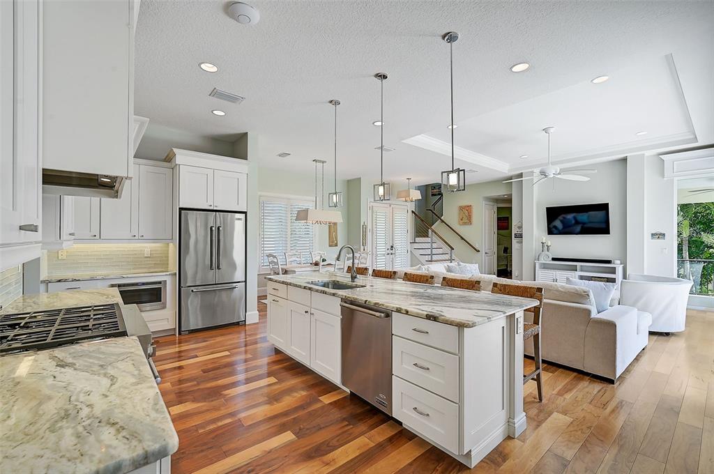 830 Tarawitt Drive Longboat Key, FL 34228 - Photo 12 of 74 a kitchen with a sink stove and refrigerator