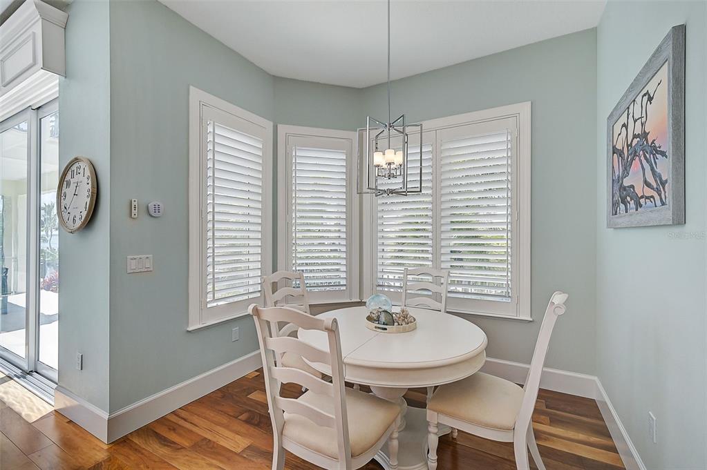 830 Tarawitt Drive Longboat Key, FL 34228 - Photo 14 of 74 a view of a dining room with furniture and window