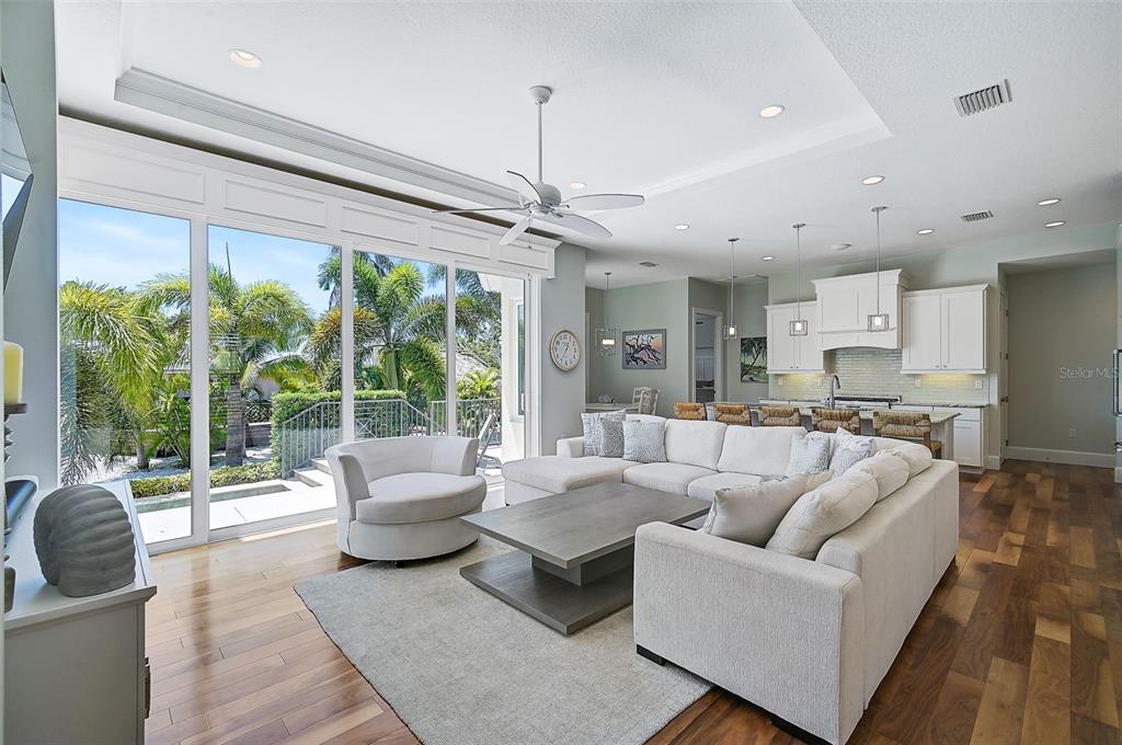 830 Tarawitt Drive Longboat Key, FL 34228 - Photo 15 of 74 a living room with furniture and a large window