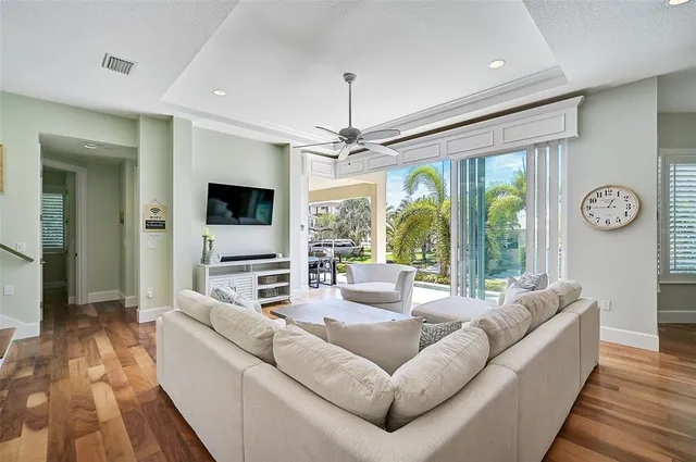 a living room with a bed furniture and a window