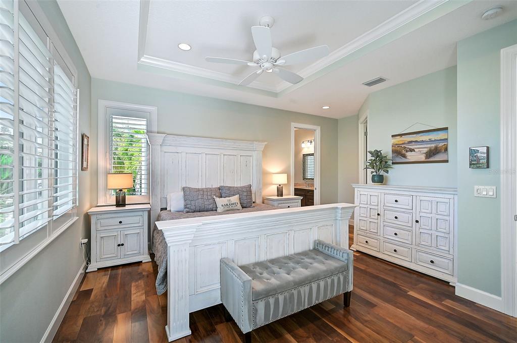 830 Tarawitt Drive Longboat Key, FL 34228 - Photo 22 of 74 a living room with furniture and windows