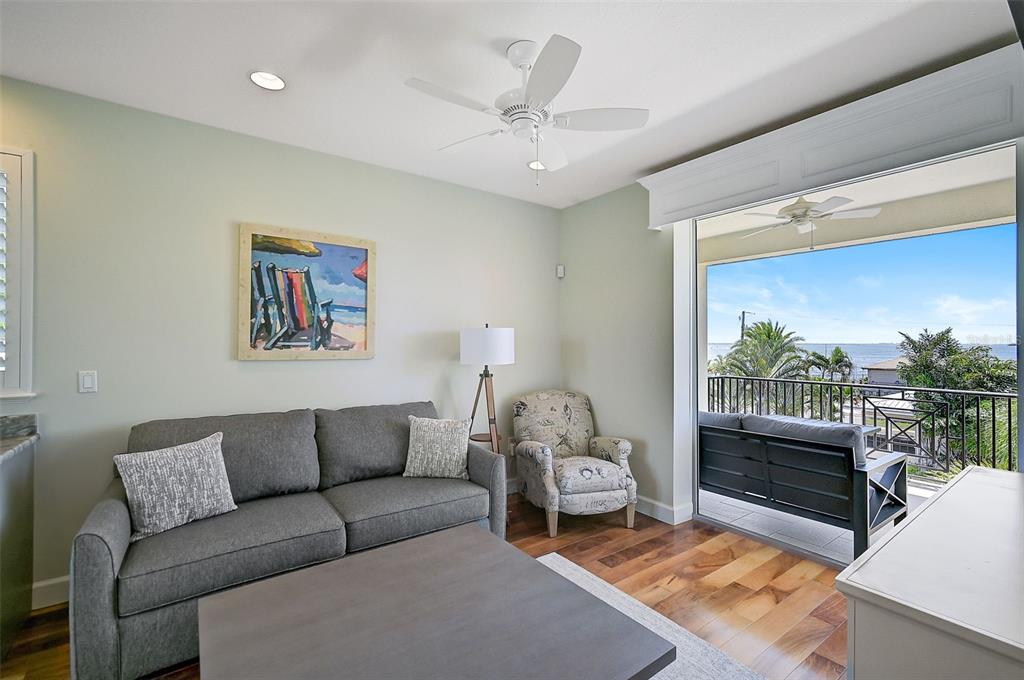 830 Tarawitt Drive Longboat Key, FL 34228 - Photo 31 of 74 a living room with furniture and a large window