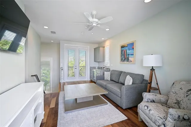 a view of a city from a balcony with furniture