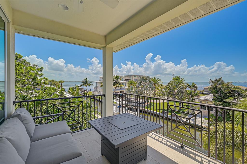 830 Tarawitt Drive Longboat Key, FL 34228 - Photo 38 of 74 a view of a city from a balcony with furniture