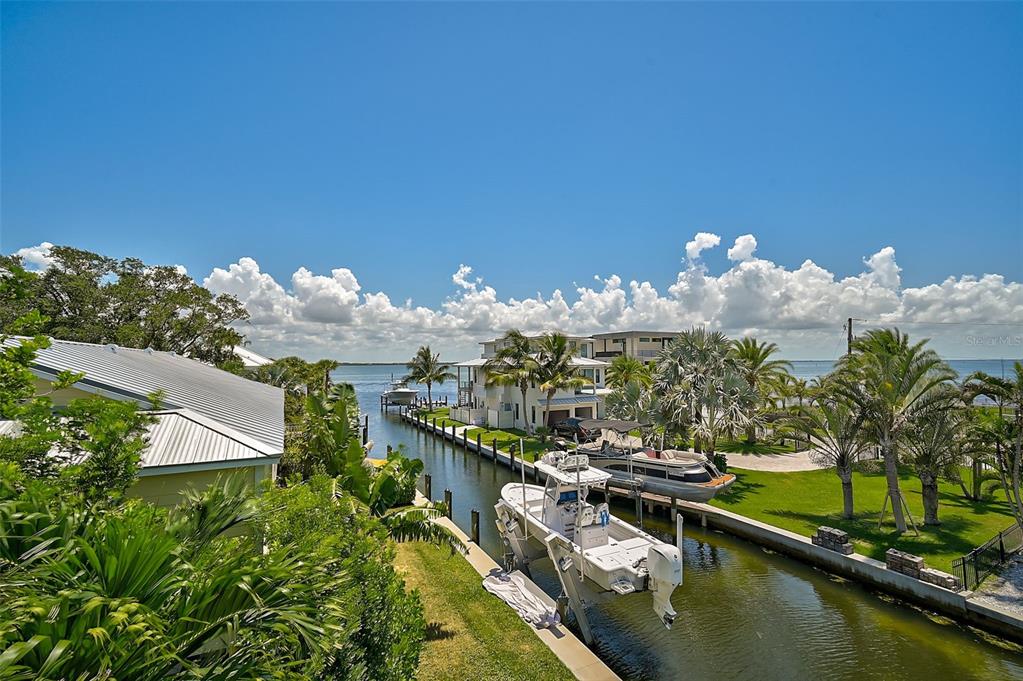 830 Tarawitt Drive Longboat Key, FL 34228 - Photo 41 of 74 a view of a house with a lake view