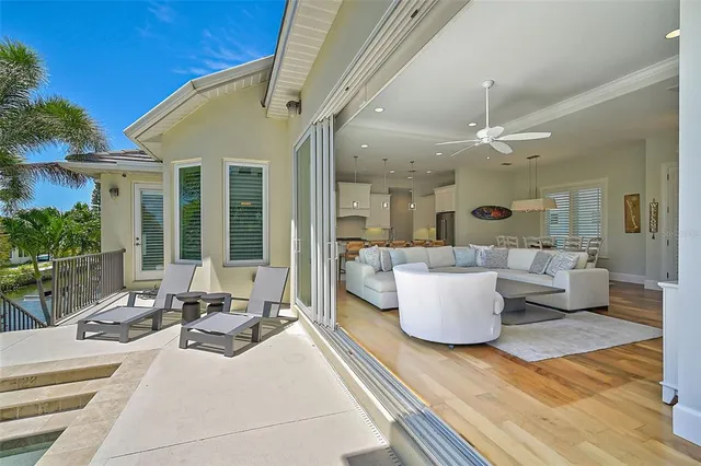 a aerial view of a house with a yard and potted plants