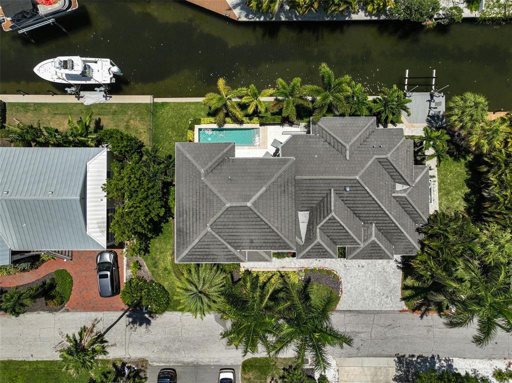 830 Tarawitt Drive Longboat Key, FL 34228 - Photo 61 of 74 an aerial view of a house with a lake view
