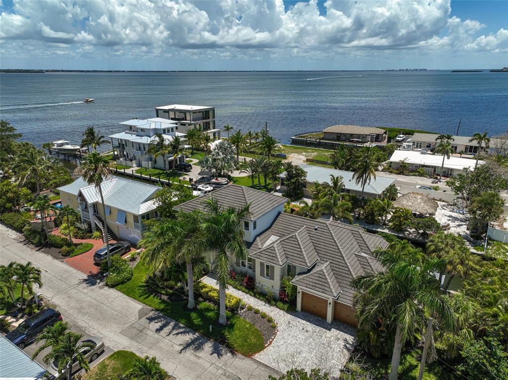 830 Tarawitt Drive Longboat Key, FL 34228 - Photo 67 of 74 a aerial view of a house with a yard and potted plants