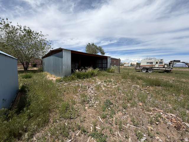 1043 East 4000th Street South Vernal, UT 84078 - Photo 7 of 31 Corrugated metal outbuilding with open-air stall