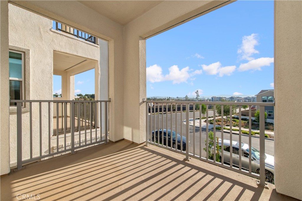 423 Flycatcher Irvine, CA 92618 - Photo 15 of 35 a view of a balcony with wooden floor