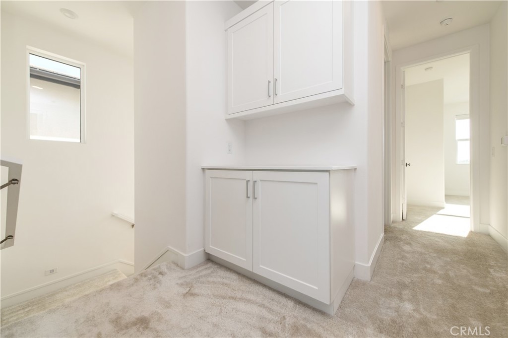 423 Flycatcher Irvine, CA 92618 - Photo 16 of 35 an empty room with cabinet