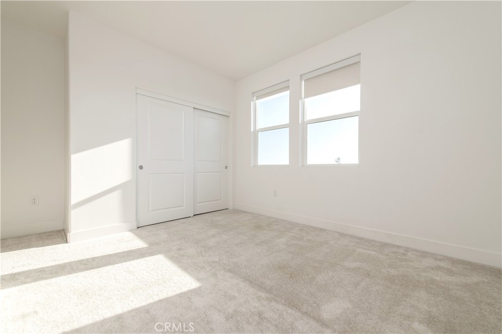 423 Flycatcher Irvine, CA 92618 - Photo 2 of 35 an empty room with windows