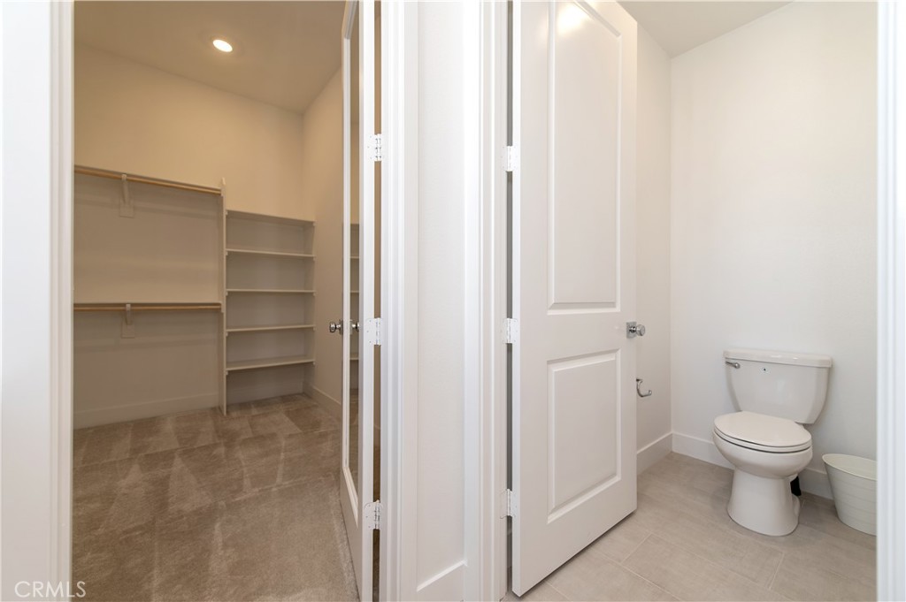 423 Flycatcher Irvine, CA 92618 - Photo 25 of 35 a bathroom with a toilet and a shower