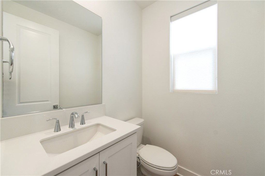 423 Flycatcher Irvine, CA 92618 - Photo 29 of 35 a bathroom with a sink a toilet and a mirror