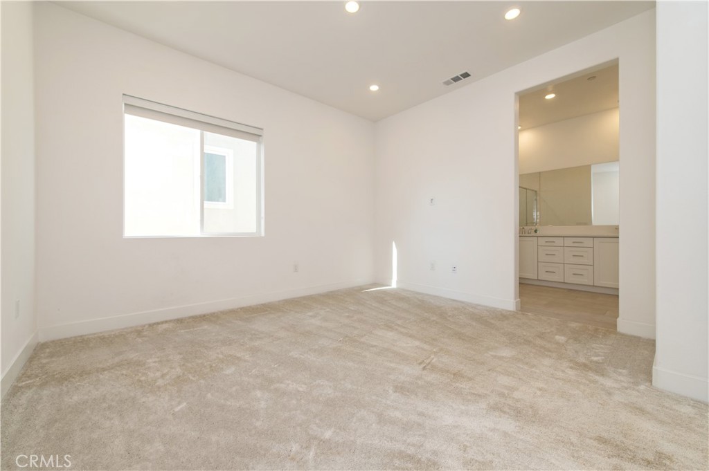 423 Flycatcher Irvine, CA 92618 - Photo 30 of 35 an empty room with windows and closet