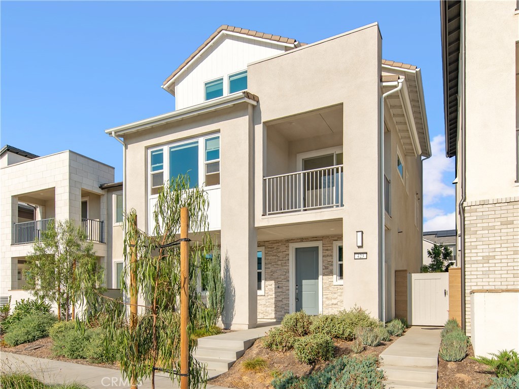 423 Flycatcher Irvine, CA 92618 - Photo 31 of 35 a front view of a house with a yard
