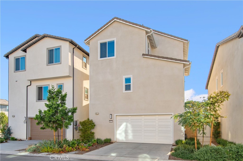 423 Flycatcher Irvine, CA 92618 - Photo 6 of 35 a front view of a house with plants