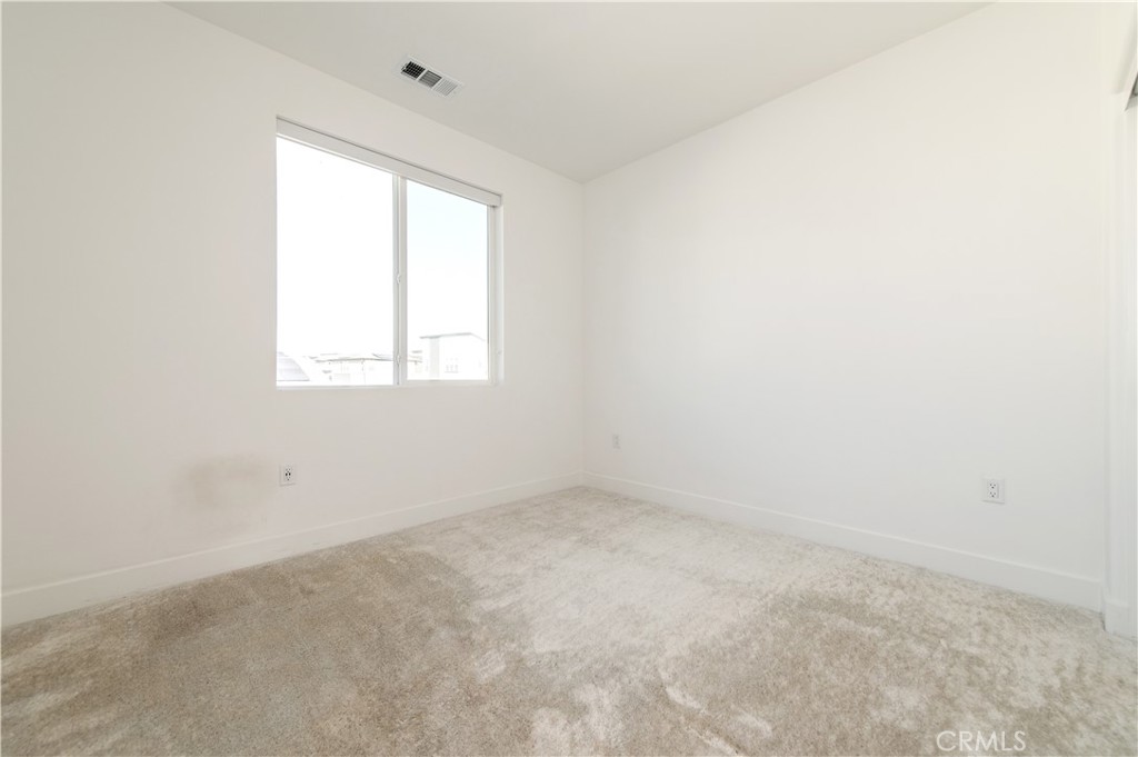 423 Flycatcher Irvine, CA 92618 - Photo 7 of 35 an empty room with a window