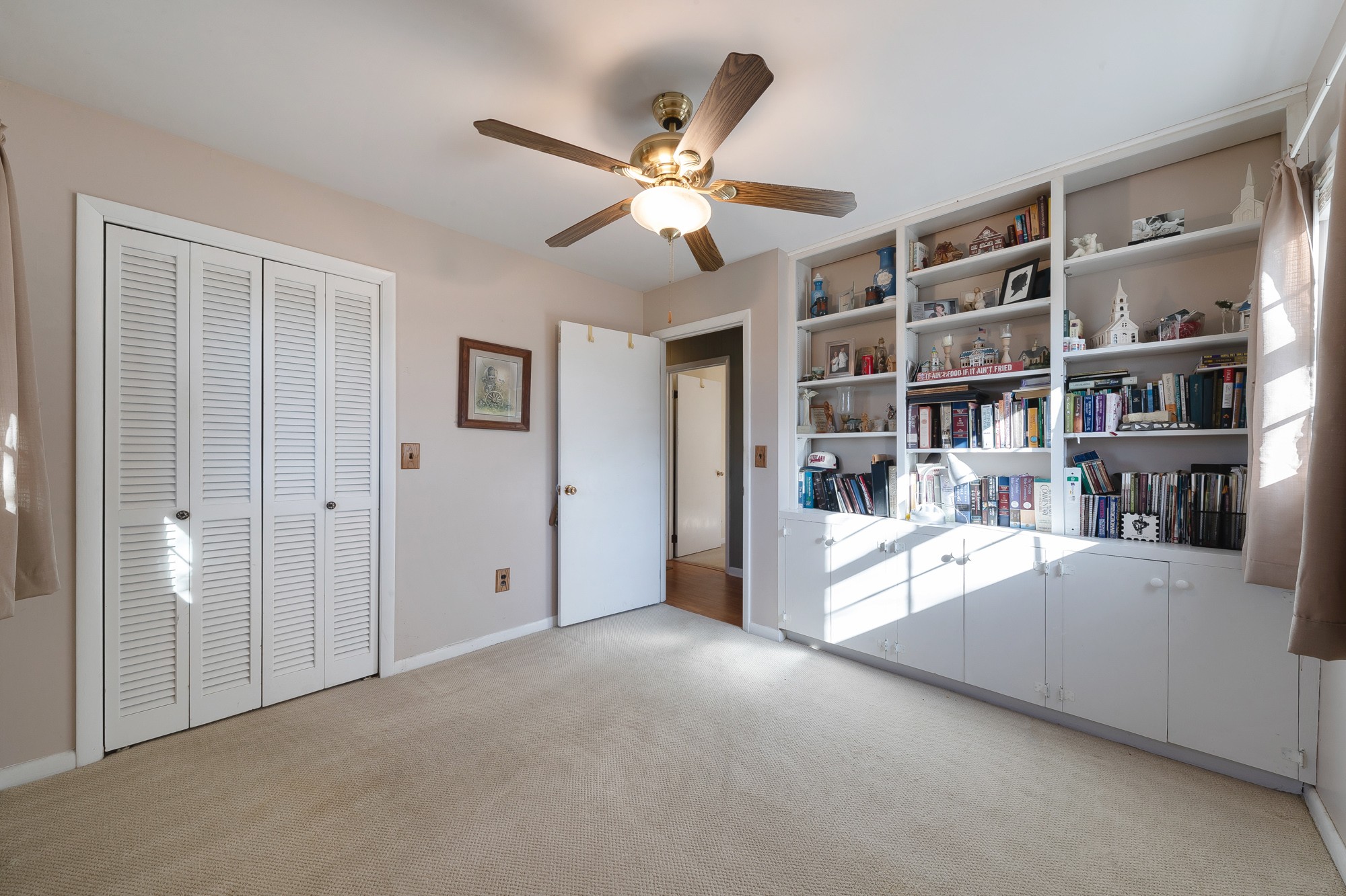 723 Bethel Road Pulaski, TN 38478 - Photo 32 of 39 a view of an empty room with bookshelf and a window