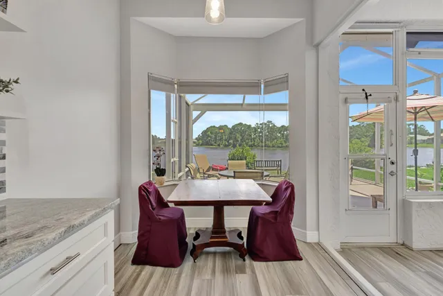 a kitchen with stainless steel appliances granite countertop a refrigerator stove and sink