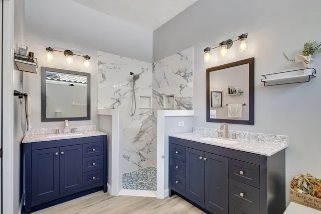 a bathroom with a bathtub shower sink and toilet