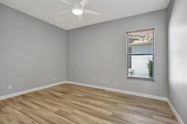 a bathroom with a sink a toilet a mirror and shower curtain