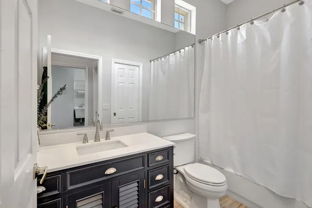 an aerial view of a house with a lake view