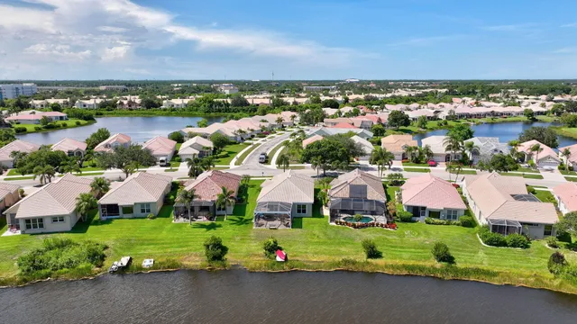 a aerial view of a house with swimming pool garden and patio