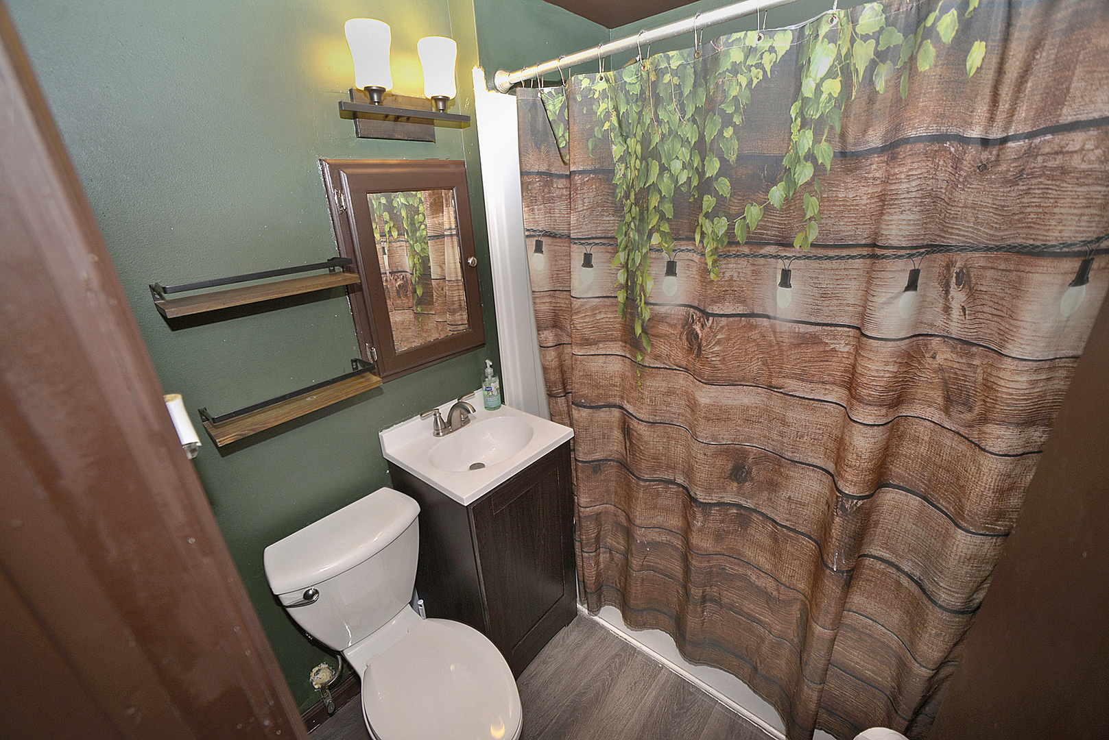 454 Washington Street Marseilles, IL 61341 - Photo 11 of 16 a bathroom with a sink toilet and mirror