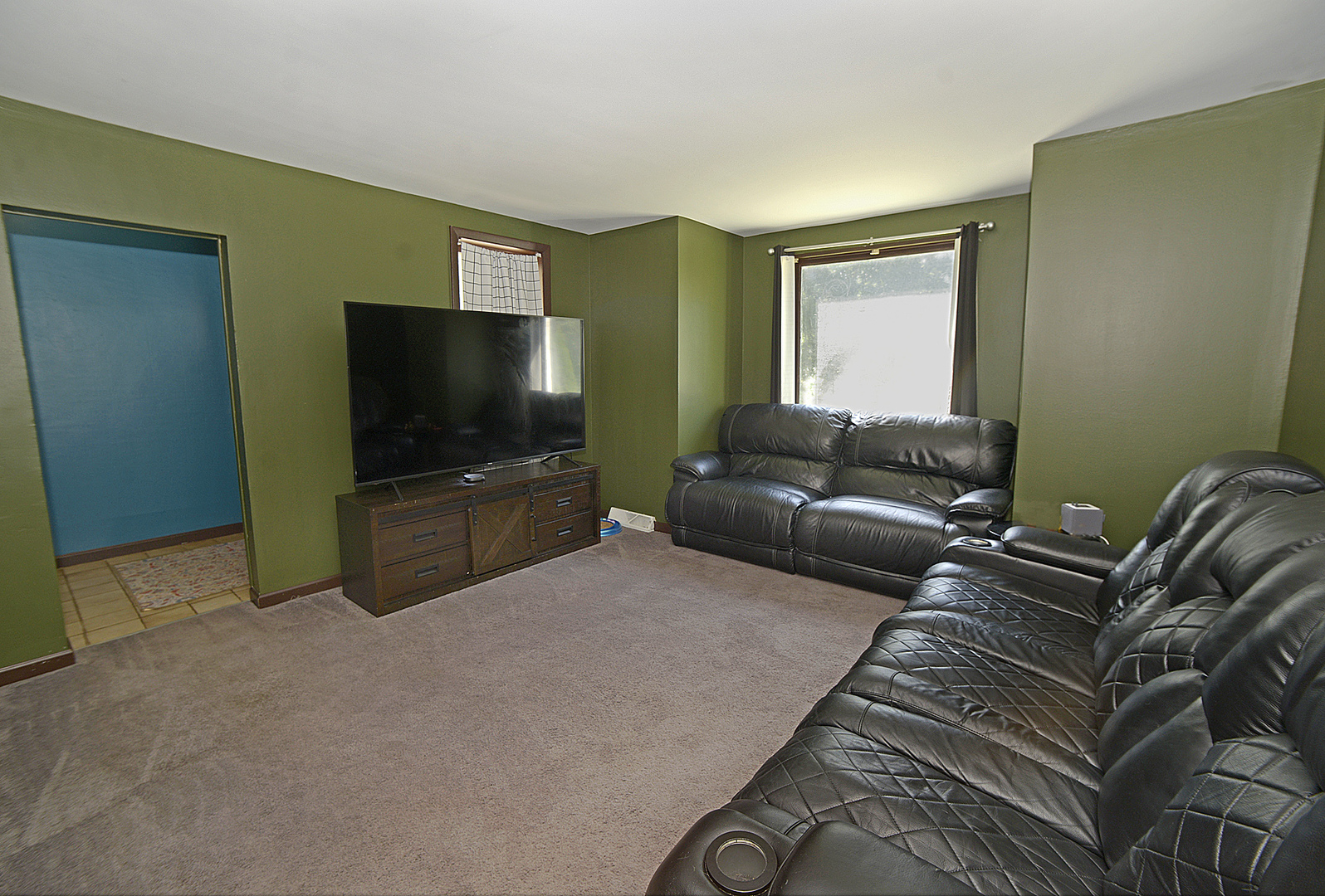 454 Washington Street Marseilles, IL 61341 - Photo 5 of 16 a living room with furniture and a flat screen tv