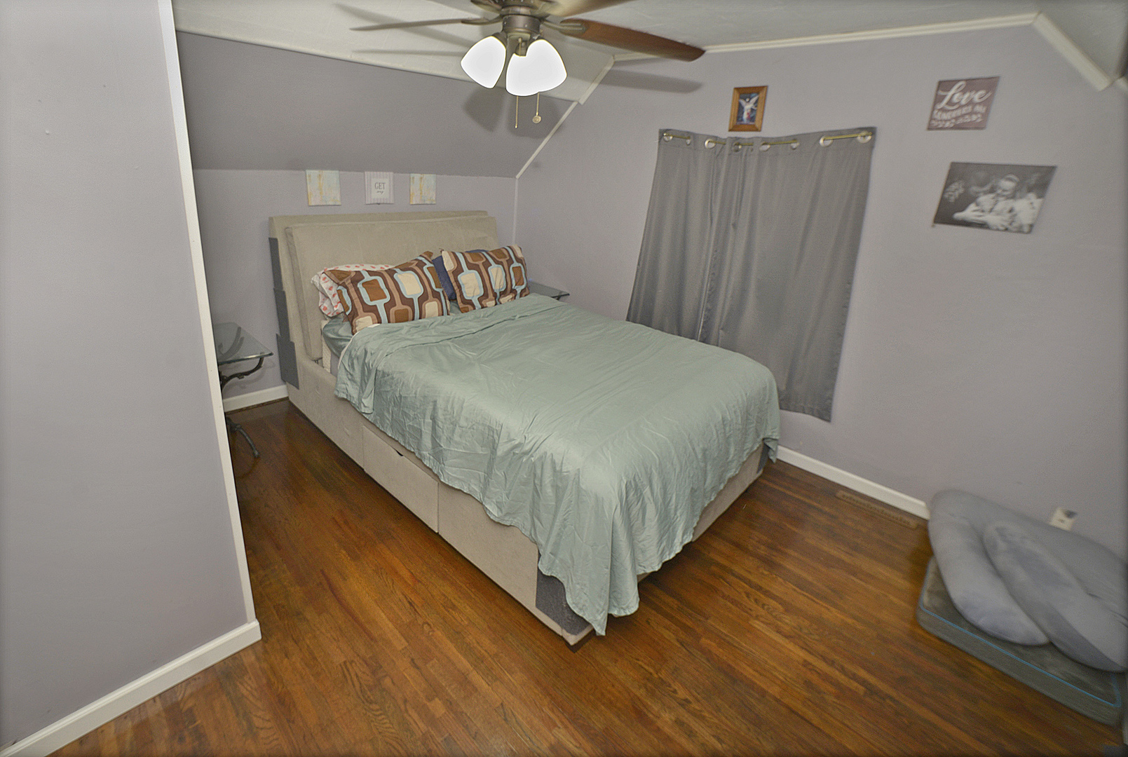 454 Washington Street Marseilles, IL 61341 - Photo 8 of 16 a bed sitting in a bedroom next to a window