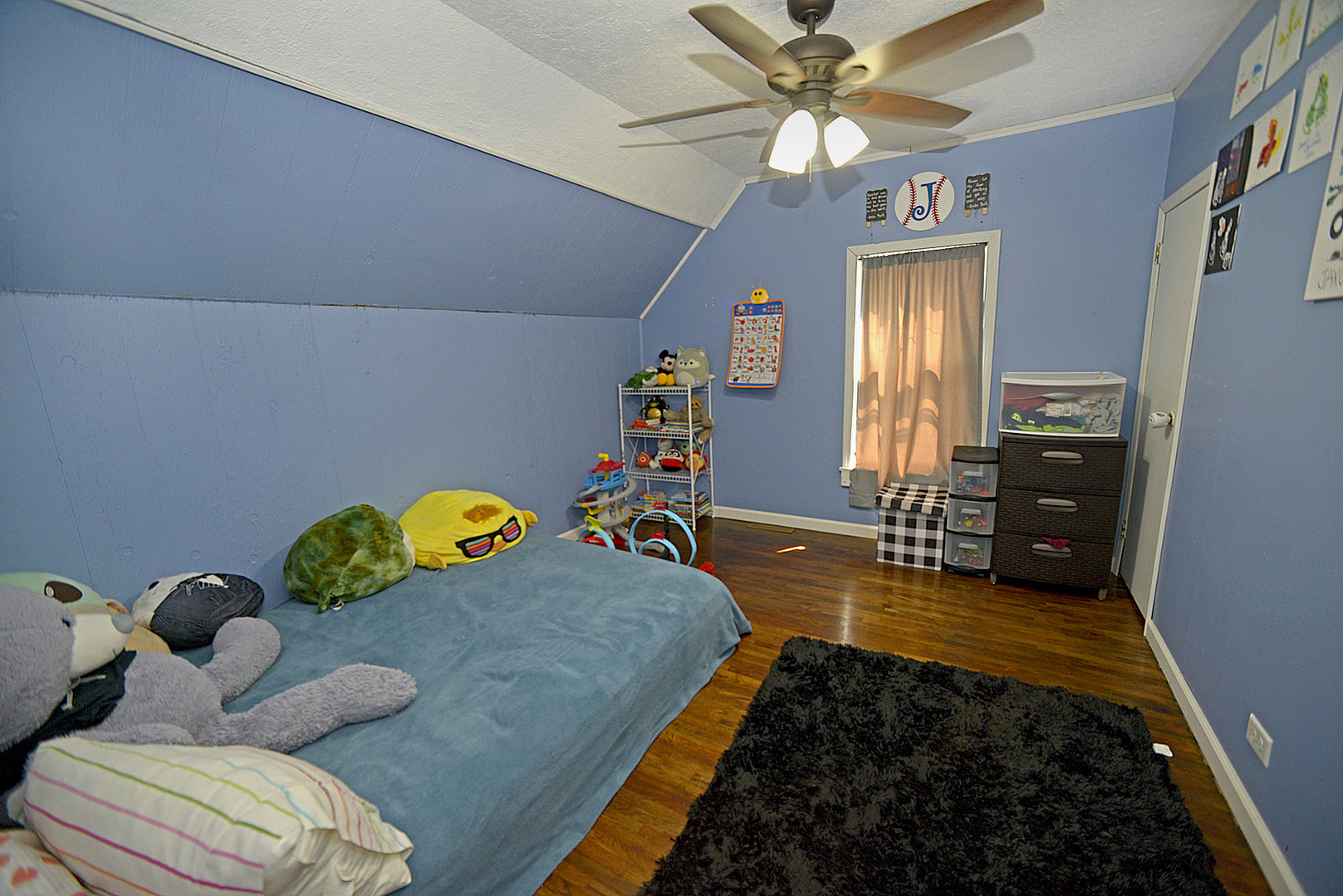 454 Washington Street Marseilles, IL 61341 - Photo 9 of 16 a bed room with bed and a chandelier