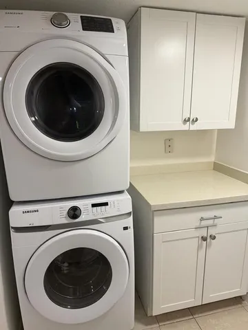 a utility room with dryer and washer