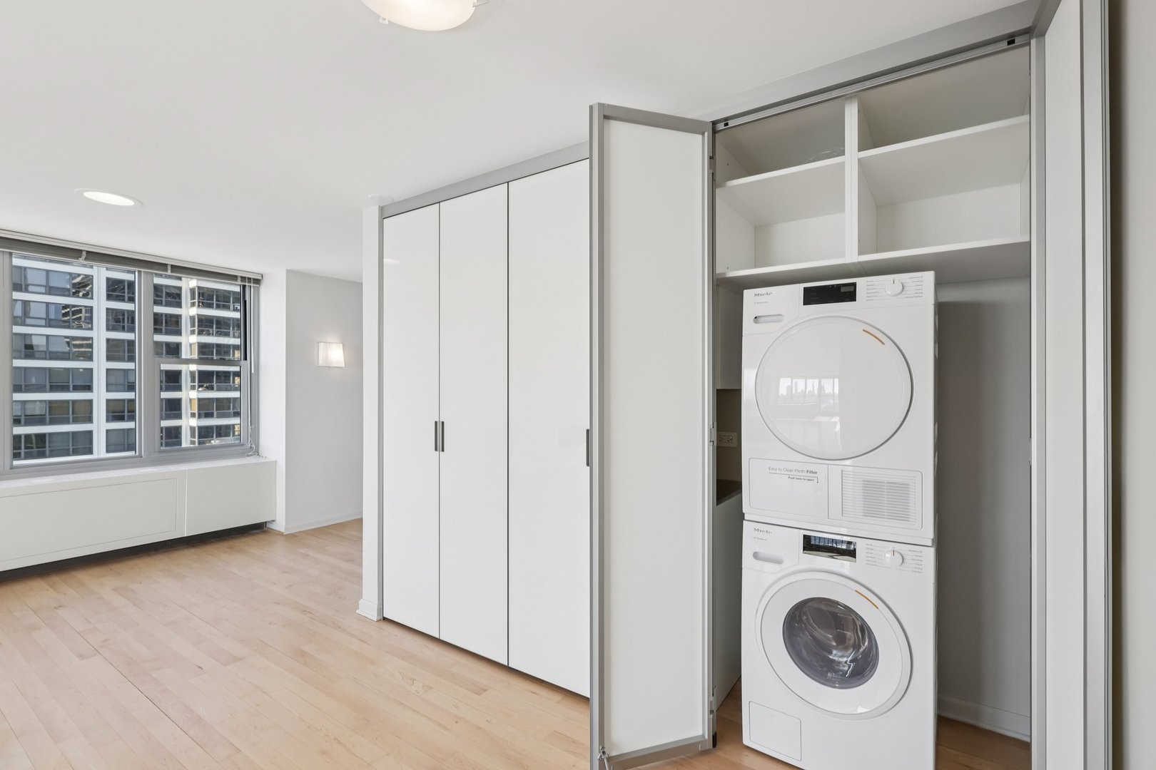 400 East Randolph Street, Unit 371920 Chicago, IL 60601 - Photo 8 of 55 a view of walk in closet with empty racks