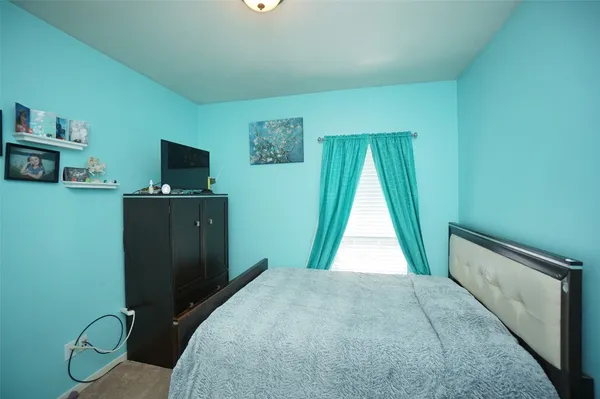 a view of a bedroom with closet area