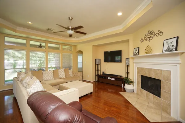 a living room with furniture fireplace and flat screen tv