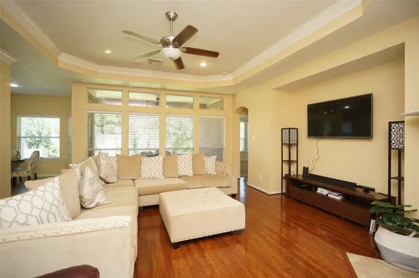 a living room with furniture and a flat screen tv