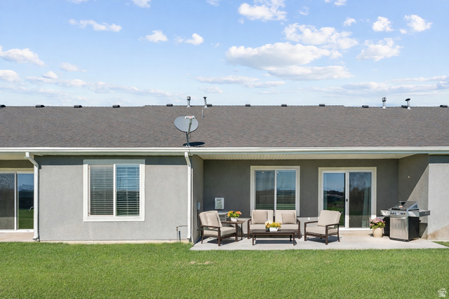 1278 South Grace Way Layton, UT 84041 - Photo 19 of 23 Expansive concrete patio with direct access to interior spaces via two sliding glass doors