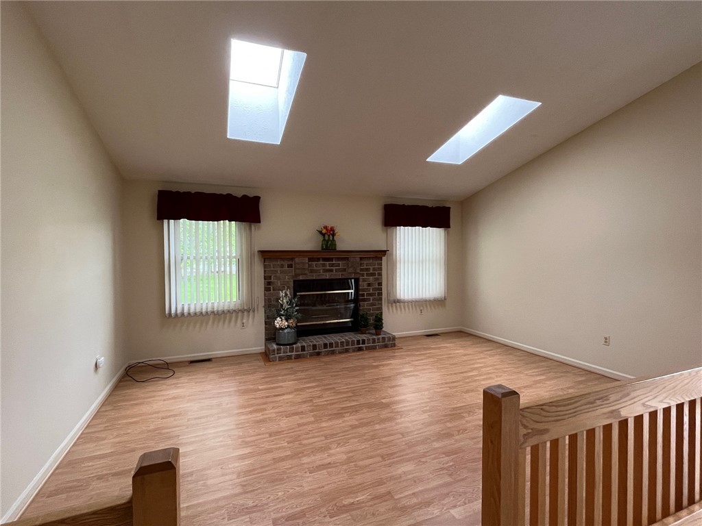 5 Daisy Lane Chili, NY 14514 - Photo 9 of 20 Beautiful floors, gas fireplace and skylights in t