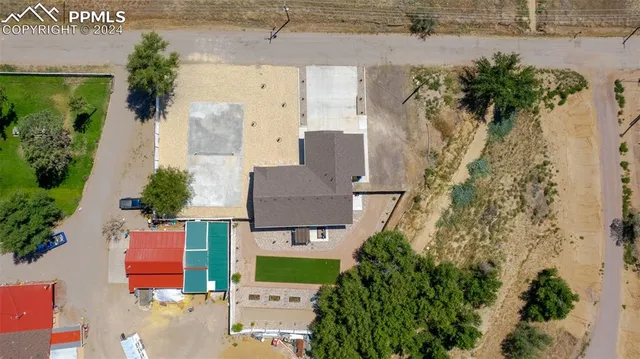 an aerial view of houses with outdoor space