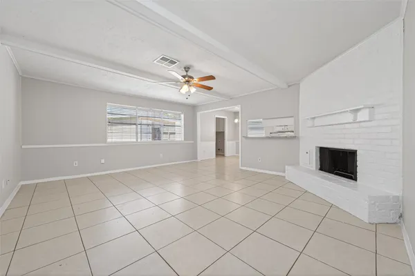 a view of a livingroom with furniture and a fireplace