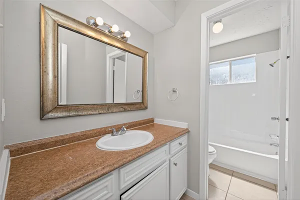 a view of a backyard with pathway