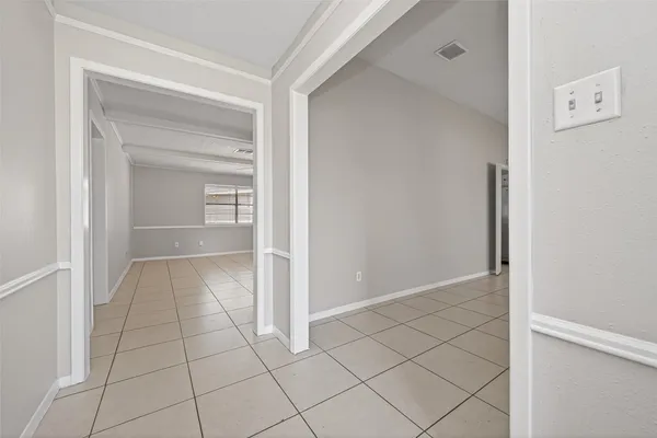 a view of an empty room and closet area